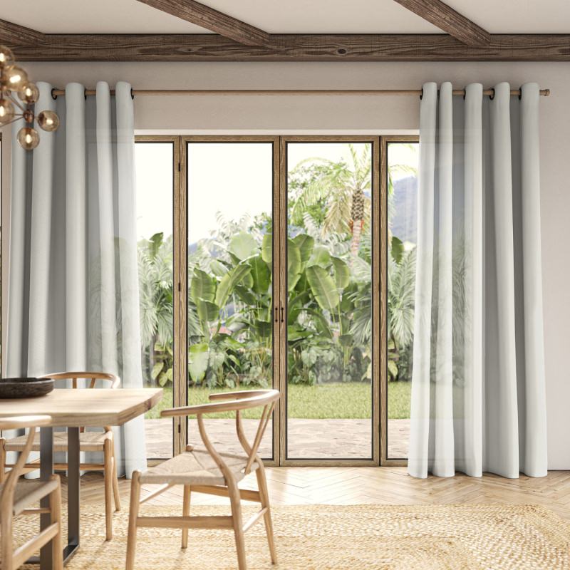 Blasket Ivory Sheer Curtain, a delicate ivory fabric, creating a bright and private space.