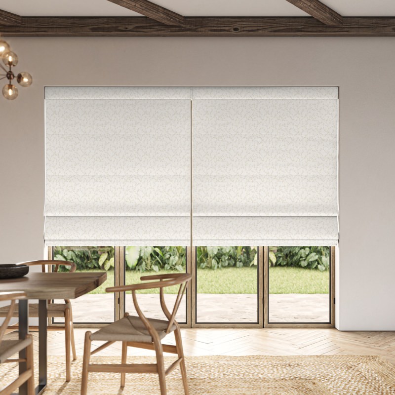 Cadence Ivory Embroidery Roman Blind showcasing a graceful, flowing embroidered pattern on a soft ivory blind