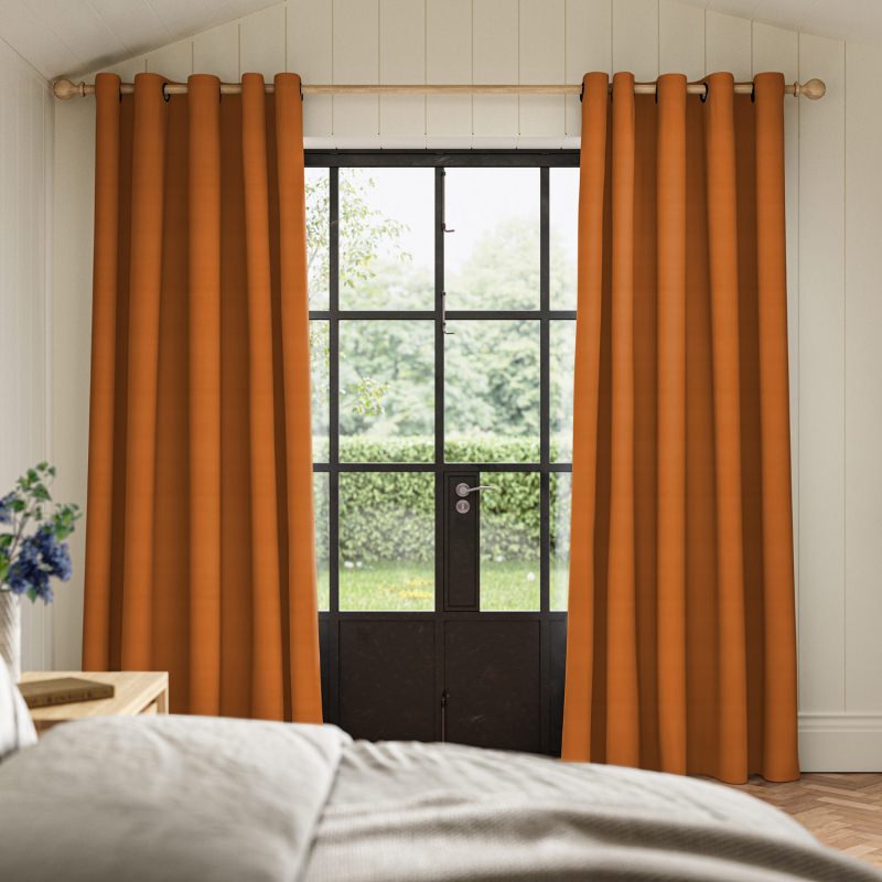 Cassandra Nectarine Velvet Curtain in a vibrant, warm orange, made from a sumptuously soft velvet.