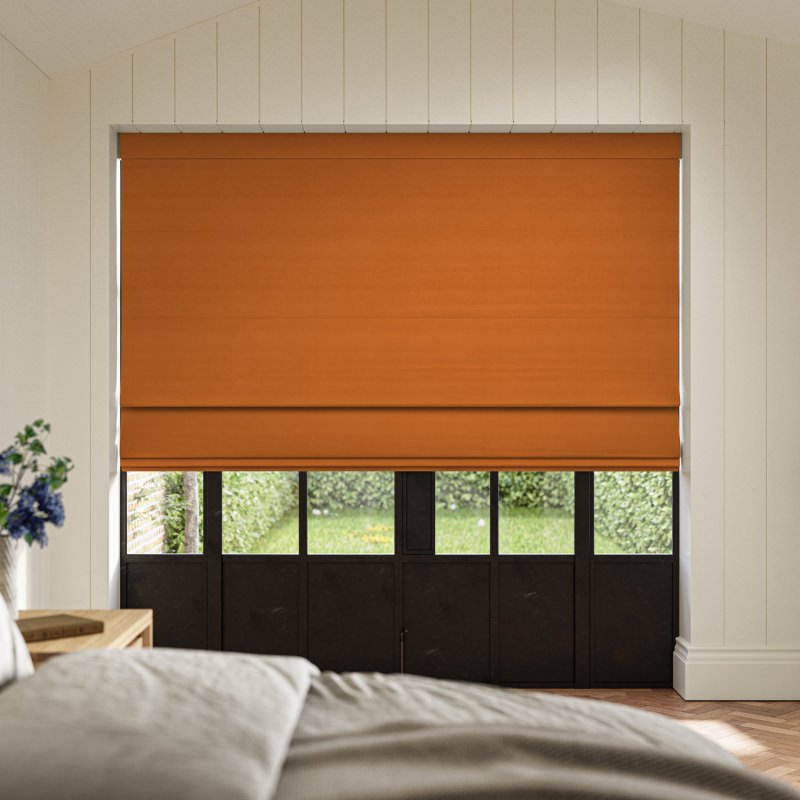 Cassandra Nectarine Velvet Roman Blind in a vibrant, warm orange, made from a sumptuously soft velvet