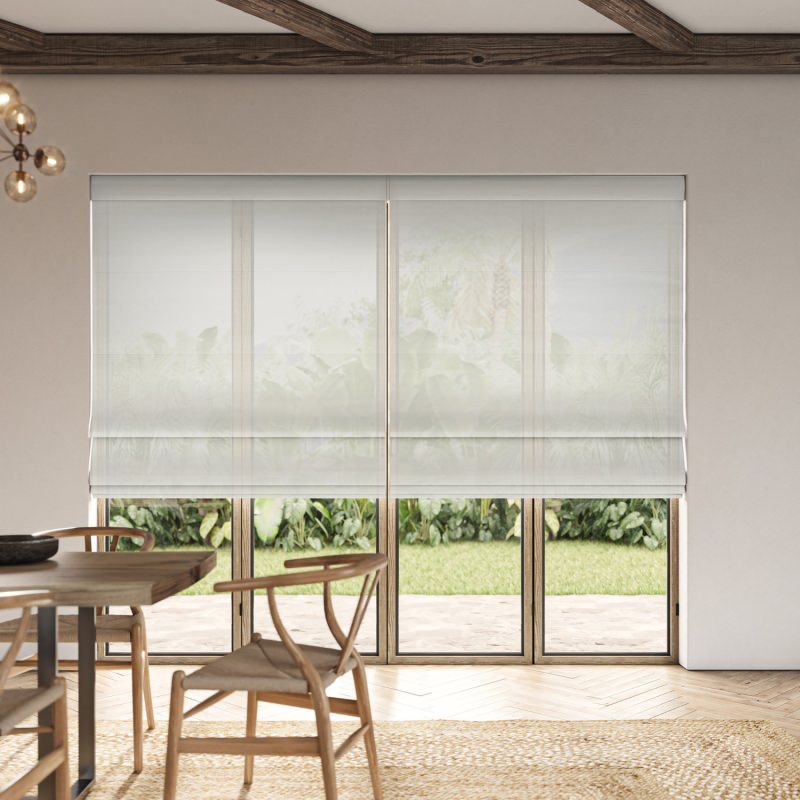 Dalkey Mist Sheer Roman Blind in a delicate grey, gently filtering light through the window