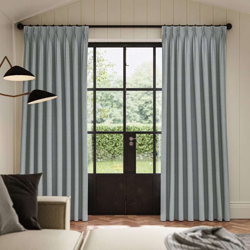 Ernest Alpine Plain Curtain in a calm and refreshing soft green fabric, hanging beautifully.