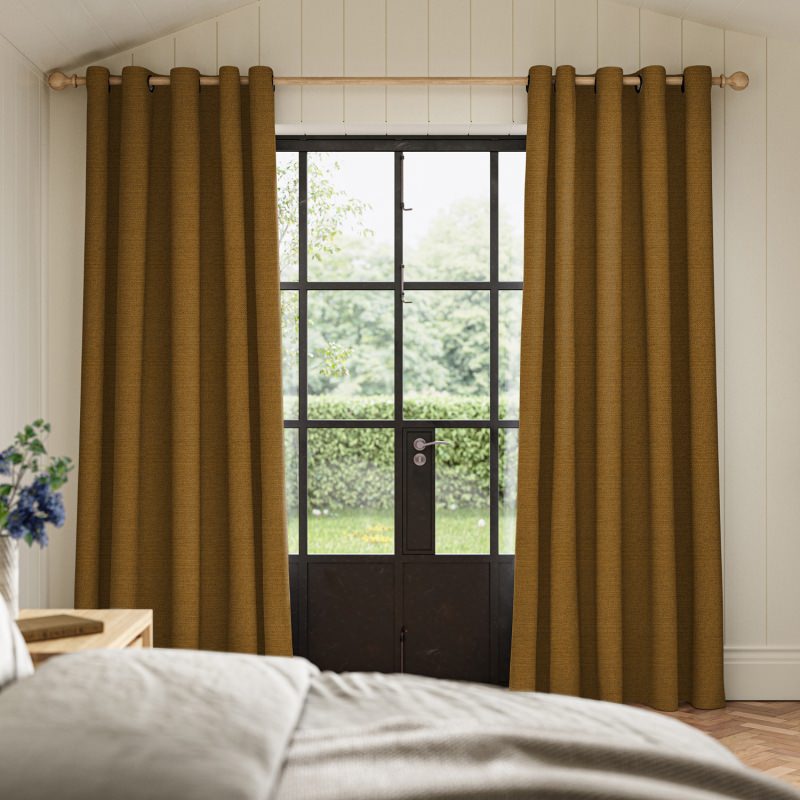 Penelope Tumeric Boucle Curtain in a vibrant, earthy yellow with a deep, cosy weave.
