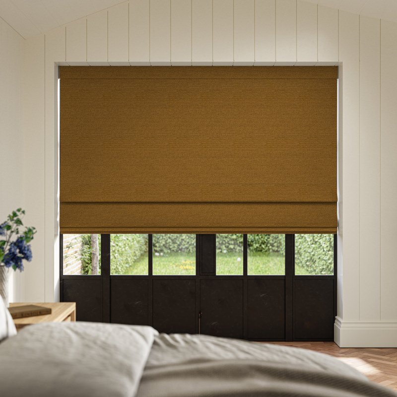 Penelope Tumeric Boucle Roman Blind in a vibrant, earthy yellow with a deep, cosy weave