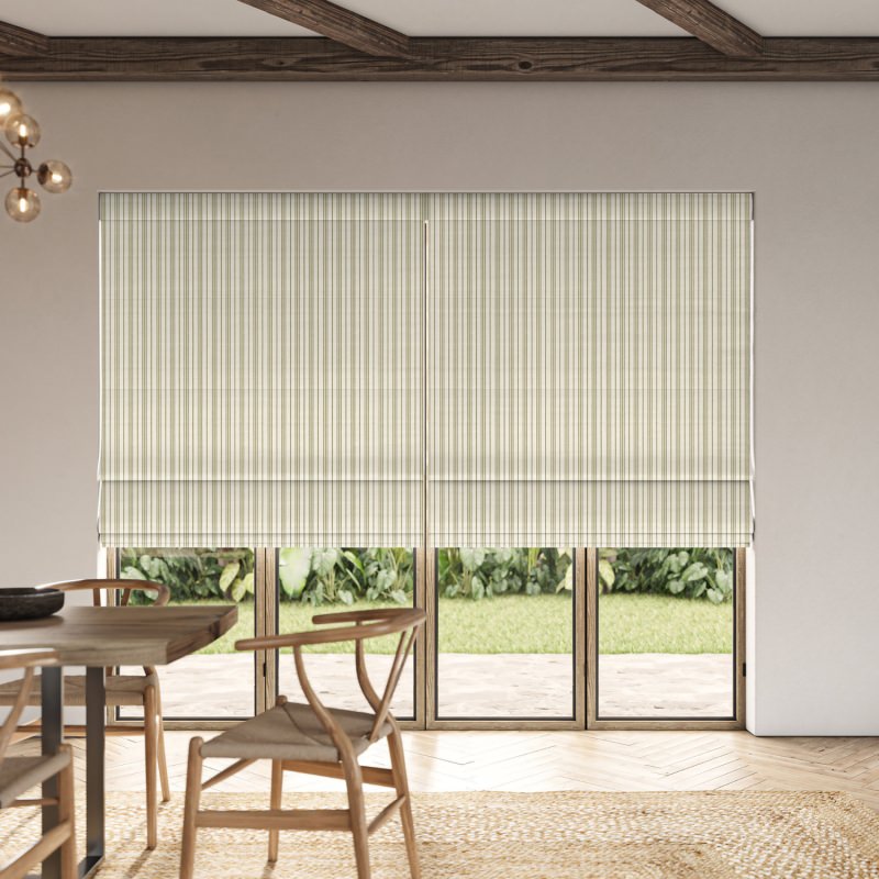 Phoebe Sage Woven Roman Blind in a soft, muted sage green with a gentle, tactile weave