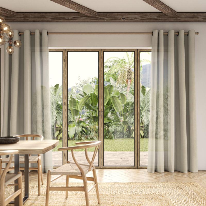 Rainey Driftwood Sheer Curtain in a soft, weathered grey, creating a coastal, airy feel.