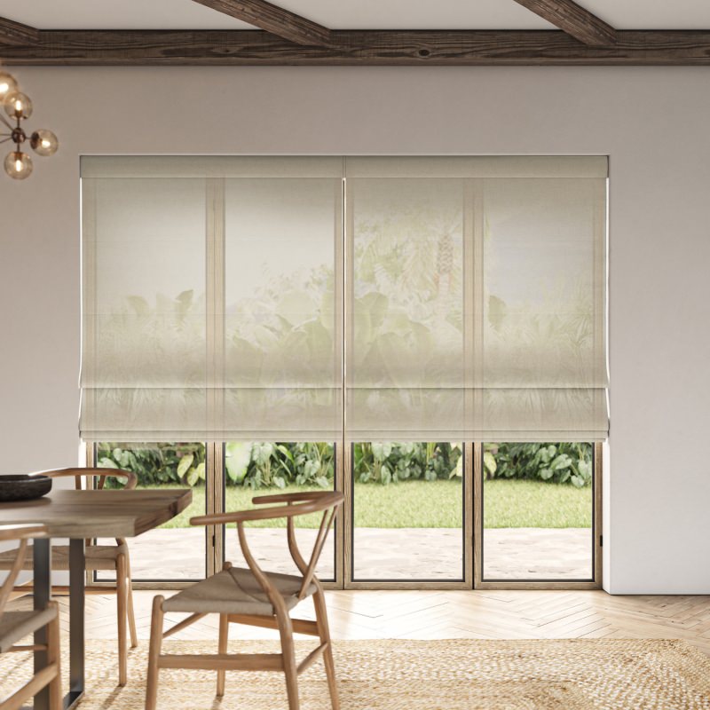 Rainey Driftwood Sheer Roman Blind in a soft, weathered grey, creating a coastal, airy feel