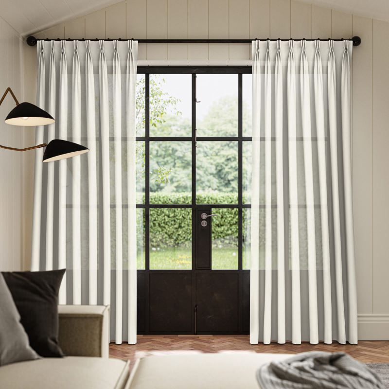 Rainey Ivory Sheer Curtain, a delicate and timeless ivory sheer fabric flowing gracefully.