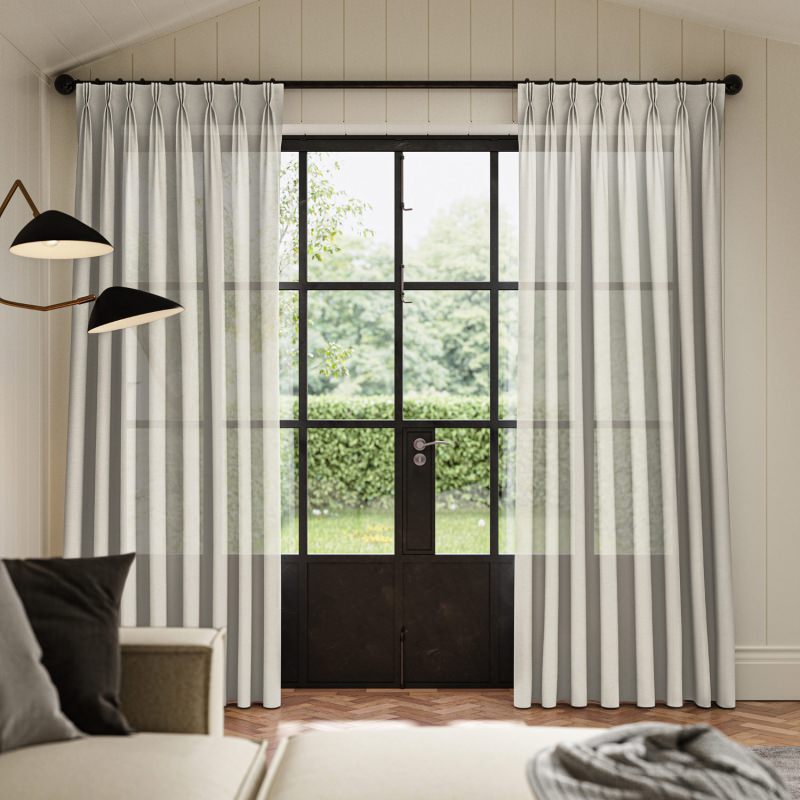 Rainey Pebble Sheer Curtain in a natural, earthy light grey, softening incoming light.
