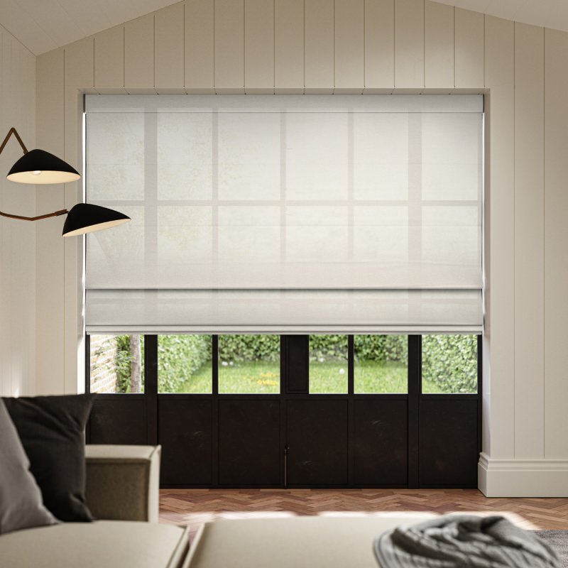 Rainey Pebble Sheer Roman Blind in a natural, earthy light grey, softening incoming light