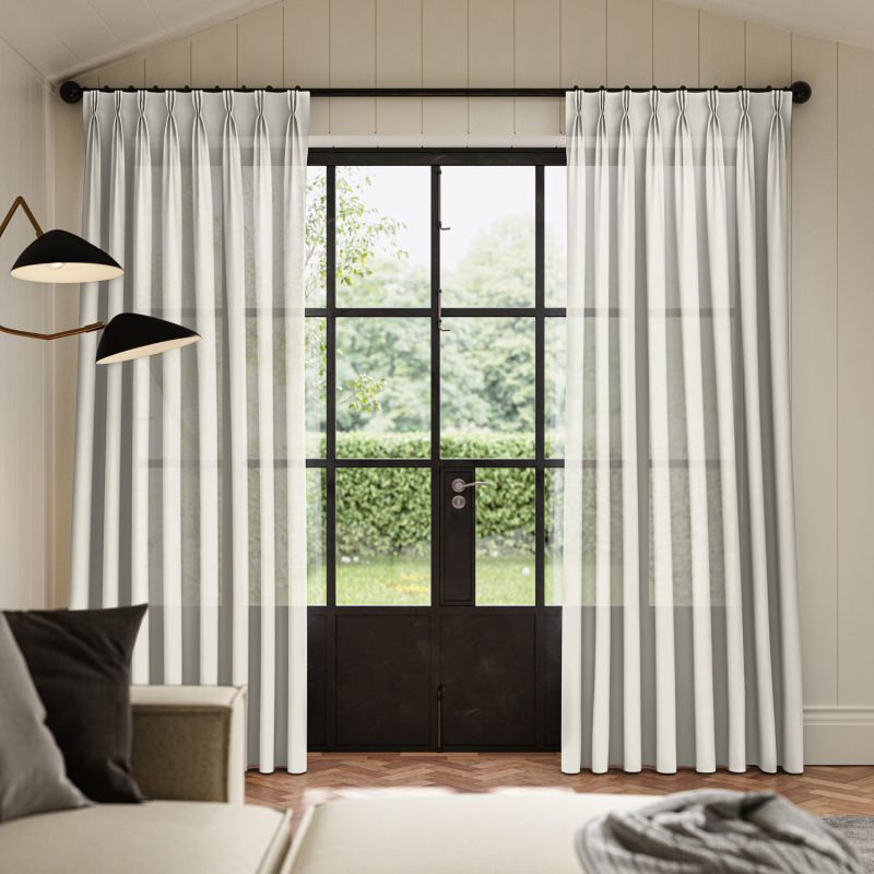 Rathlin Ivory Sheer Curtain, a delicate warm ivory fabric, creating a soft-focus light effect.
