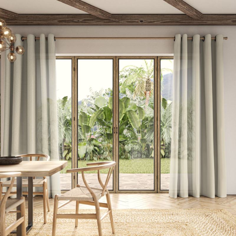 Rathlin Sand Sheer Curtain in a warm sandy hue, creating a sun-kissed, coastal feel.