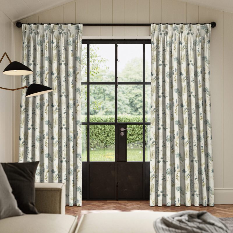 Rubina Azure Printed Curtain with a vibrant and artistic floral pattern in brilliant blue.
